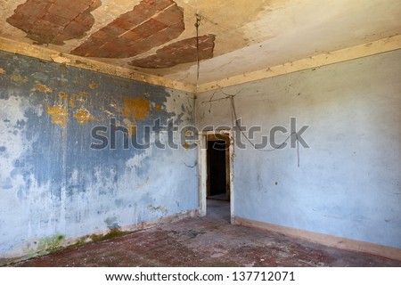 empty room of an abandoned house - old dirty hall in ruins