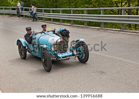 PASSO DELLA FUTA (FI), ITALY - MAY 18: unidentified drivers on an old racing car Bugatti T 35 A (1925) runs in the famous historical race Mille Miglia on May 18, 2013 in Passo della Futa (FI) Italy