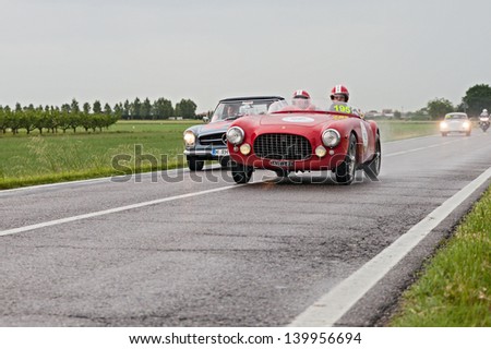 RAVENNA, ITALY - MAY 17: unidentified drivers on the old racing car Ferrari 212 export (1951) in rally Mille Miglia, the famous italian historical race (1927-1957) on May 17, 2013 in Ravenna, Italy