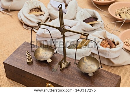 old brass scales to weigh herbs and spices in old grocery - ancient precision scale with wooden case