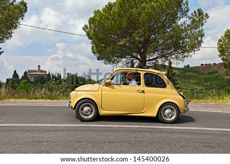 Fognano (Ra), Italy - July 7: Unidentified Crew On A Vintage Tuned Car Fiat 500 Runs On The Italian Hills During The Rally &Quot;Raduno Auto E Moto D\'Epoca&Quot; On July 7, 2013 In Fognano, Ra, Italy