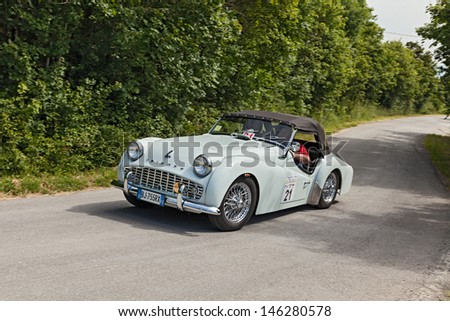 MELDOLA, FC, ITALY - JUNE 2: unidentified drivers on a vintage car Triumph TR3 A (1960) runs in rally \