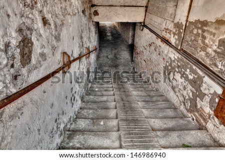 steps down to the underpass - descent with stairs to a narrow dark gallery in the old italian town