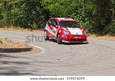 DOVADOLA, ITALY - JULY 28: the crew Serri - Palu\' on a racing car Citroen C2 R2 max in hairpin bend at Rally della Romagna 2013, on July 28, 2013 in Dovadola, FC, Italy