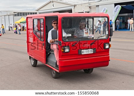 LUGO. RA. ITALY  SEPTEMBER 19: driver Andrea Pavone on the Boxel (1984), italian electric van for urban use, pioneer of the electric vehicle, at Expo\' AEM-ZERO on September 19, 2013 in Lugo. RA. Italy