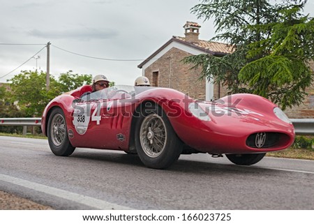 RAVENNA, ITALY - MAY 17: unidentified crew on a vintage racing car Maserati Maserati 200 SI (1957)  in rally Mille Miglia 2013, italian historical race (1927-1957) on May 17, 2013 in Ravenna, Italy