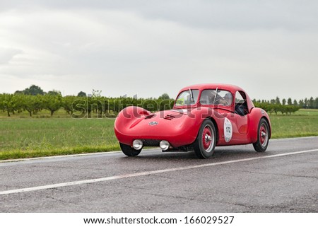 RAVENNA, ITALY - MAY 17: unidentified drivers on a vintage sports car Fiat Revelli Spyder with hard top (1947) in Mille Miglia 2013, the italian historical race, on May 17, 2013 in Ravenna, Italy
