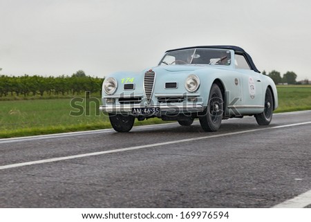 RAVENNA, ITALY - MAY 17: unidentified drivers on a vintage car Alfa Romeo 6C 2500 SS Cabriolet (1948) in rally Mille Miglia 2013, the italian historical race, on May 17, 2013 in Ravenna, Italy