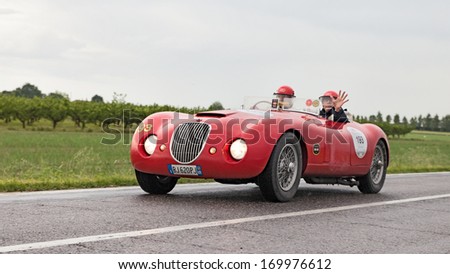 RAVENNA, ITALY - MAY 17: unidentified drivers on an old racing car Jaguar Biondetti Sport (1950) in rally Mille Miglia 2013, the italian historical race (1927-1957) on May 17, 2013 in Ravenna, Italy