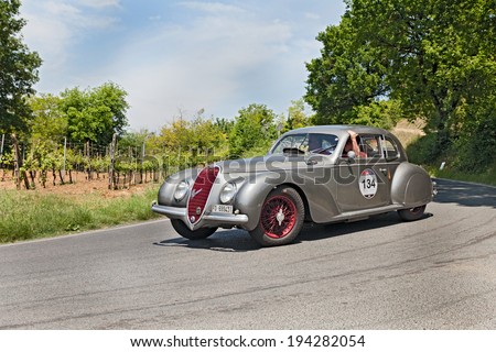 COLLE DI VAL D\'ELSA, SI, ITALY - MAY 17: unidentified crew on a vintage sport car Alfa Romeo 6C 2500 SS (1939) runs in historical race Mille Miglia, on May 17, 2014 in Colle di Val d\'Elsa, SI, Italy
