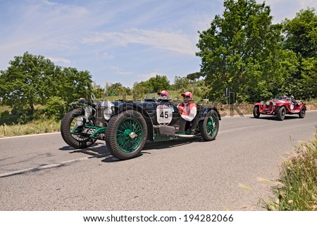 COLLE DI VAL D\'ELSA, ITALY - MAY 17: unidentified crew on a vintage sport car Riley 9 Brooklands Speed (1928) runs in historical race Mille Miglia, on May 17, 2014 in Colle di Val d\'Elsa, SI, Italy