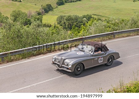 COLLE DI VAL D\'ELSA, SI, ITALY - MAY 17: unidentified crew on a vintage sport car Alfa Romeo 6C 2300 B MM spider Touring (1947) runs in race Mille Miglia on May 17, 2014 in Colle di Val d\'Elsa, Italy
