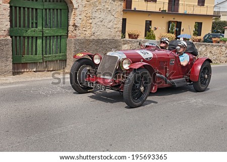 COLLE DI VAL D\'ELSA, SI, ITALY - MAY 17: unidentified crew on a vintage sport car Maserati Tipo 26 M Sport (1930) in historical rally Mille Miglia, on May 17, 2014 in Colle di Val d\'Elsa, SI, Italy