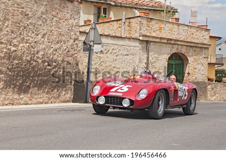 COLLE DI VAL D\'ELSA, SI, ITALY - MAY 17: unidentified crew on a vintage car Ferrari 500 TR spider Scaglietti (1956) in historical rally Mille Miglia, on May 17, 2014 in Colle di Val d\'Elsa, SI, Italy