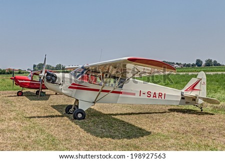 LUGO, RA, ITALY - JUNE 7: a vintage american aircraft Piper J-3 C I-Sari (1944) exposed at festival \