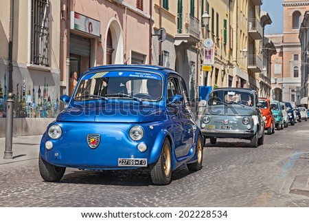 FORLI\', ITALY - JUNE 8: unidentified crew on a blue vintage Fiat 500 Abarth leads a line of italian mini cars during the rally \