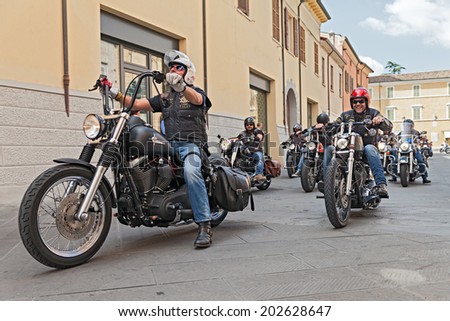 LUGO, RA, ITALY - SEPTEMBER 22: a group of bikers riding american motorbikes Harley Davidson at motorcycle rally \