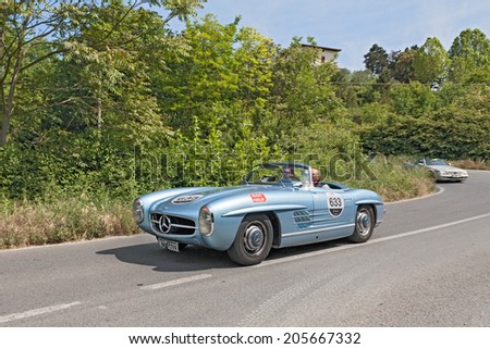 COLLE DI VAL D\'ELSA, SI, ITALY - MAY 17: the crew Marco, Paolo Cefis on a vintage car Mercedes Benz (1955) in Mercedes tribute to Mille Miglia, on May 17, 2014 in Colle di Val d\'Elsa, Tuscany, Italy