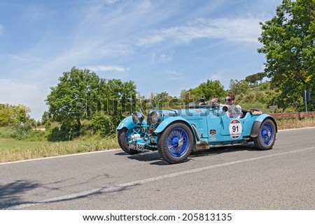 COLLE DI VAL D'ELSA, SI, ITALY - MAY 17: the crew Jan and Karel Ten Cate on a racing car Aston Martin  Le Mans (1933) in race Mille Miglia, on May 17, 2014 in Colle di Val d'Elsa, Tuscany, Italy