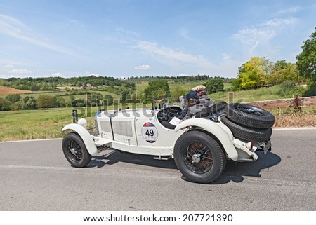COLLE DI VAL D\'ELSA, SI, ITALY - MAY 17: the crew Wuelfing - Pfeiffer on a racing car Mercedes-Benz 710 SSK (1928) in italian race Mille Miglia, on May 17, 2014 in Colle Val d\'Elsa, Tuscany, Italy