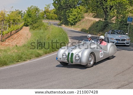 COLLE DI VAL D\'ELSA, SI, ITALY - MAY 17: the crew Robertson - Berry on a vintage racing car BMW 328 roadster (1939) in historical race Mille Miglia, on May 17, 2014 in Colle di Val d\'Elsa, SI, Italy