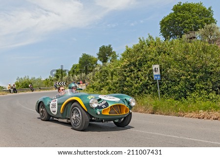COLLE DI VAL D\'ELSA, SI, ITALY - MAY 17: the crew Lombard - Beche on a vintage racing car Aston Martin  DB 3 S (1953) in rally Mille Miglia, on May 17, 2014 in Colle di Val d\'Elsa, Tuscany, Italy