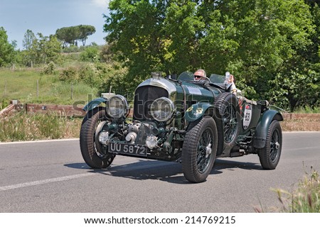 COLLE DI VAL D'ELSA, SI, ITALY - MAY 17: the crew Schreiber - Ostman on racing car Bentley 4.5 Litre S.C. (1930) in historical race Mille Miglia, on May 17, 2014 in Colle Val d'Elsa, Tuscany, Italy
