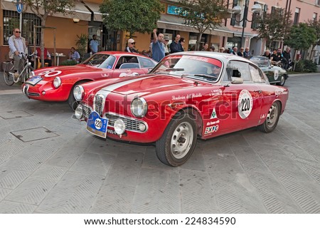 CONSELICE, RA, ITALY - SEPTEMBER 21: the crew Monti - Ballerio on Alfa Romeo Giulietta Sprint Veloce (1961) in classic car race \