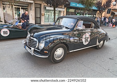 CONSELICE, RA, ITALY - SEPTEMBER 21: the crew Basalu\' Romani on an old german car Auto Union GmbH DKW 3=6 (1956) in historic race \