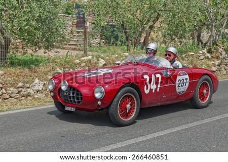 COLLE VAL D\'ELSA, SI, ITALY - MAY 17: drivers J. Newman P. Hardy on a vintage sports car Ermini 1100 Sport Motto (1952) in classic car race Mille Miglia on May 17, 2014 in Colle Val d\'Elsa, SI, Italy