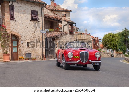 COLLE VAL D\'ELSA, SI, ITALY - MAY 17: crew E. Thevenet P. Thevenet on a vintage Lancia Aurelia B24 Spider America (1955) in classic car race Mille Miglia, on May 17, 2014 in Colle Val d\'Elsa SI Italy