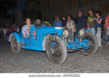 RAVENNA, ITALY - MAY 14: drivers on ancient Italian car Bugatti  T 37  (1926) traveling at night in italian historic race for classic cars Mille Miglia on May 14, 2015 in Ravenna, Italy