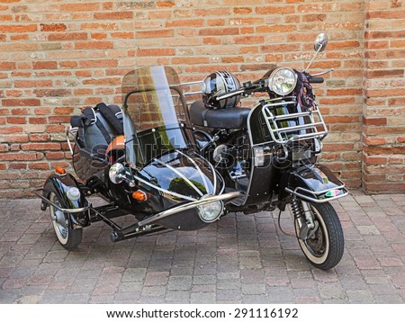 CESENA, ITALY - JUNE 2: vintage Italian scooter Vespa with sidecar in classic car and motorcycle rally \