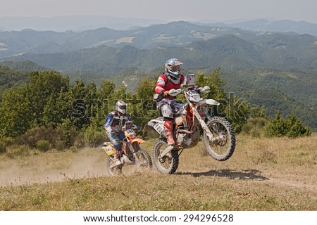 PREDAPPIO, ITALY - JULY 5: bikers riding enduro motorcycles KTM 510 and KTM EXC 250 in the mountains during the Italian championship Motorally Terre di Romagna on July 5, 2015 in Predappio, FC, Italy