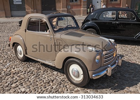 LUGO, RA, ITALY - AUGUST 30: old italian small car Fiat 500 C Topolino Trasformabile (1954) parked during the classic car, motorcycle and bicycle rally, on August 30, 2015 in Lugo, Ravenna, Italy