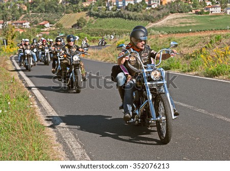 RIOLO TERME, ITALY - SEPTEMBER 22: biker rides Harley Davidson motorbike with a group of bikers at motorcycle rally \