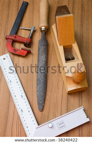 woodworking tools, carpentry equipment, instruments for joinery on teak wooden board