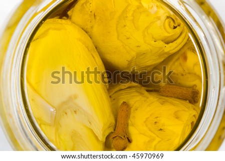 italian artichoke preserved in olive oil - traditional home made vegetables preparation with cloves