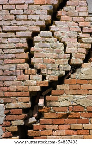large crack in the house in ruins - wall of house destroyed during earthquake