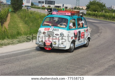 FORLI\', ITALY - MAY 13: unidentified crew drives a Fiat 600 Multipla of the sponsoring company in stage Bologna-Roma of the \