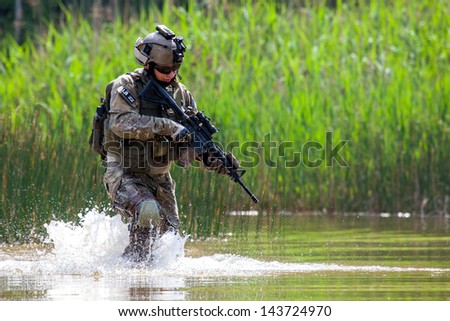 Soldiers in uniform of the U.S Army on the battlefield Soldiers in uniform of the U.S Army on the battlefield