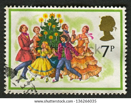 UK - CIRCA 1978: A stamp printed in UK shows image of The Singing Carols round the Christmas Tree, circa 1978.
