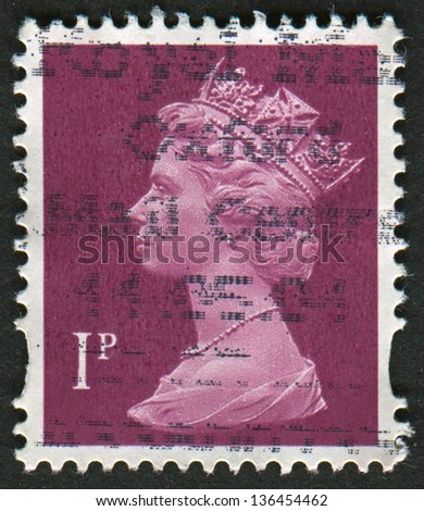 UK-CIRCA 1996:A stamp printed in UK shows image of Elizabeth II is the constitutional monarch of 16 sovereign states known as the Commonwealth realms, in brown, circa 1996.