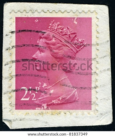 ENGLAND-CIRCA 1971:A stamp printed in ENGLAND shows image of Elizabeth II (Elizabeth Alexandra Mary, born April 21, 1926) is the constitutional monarch of United Kingdom in pink, circa 1971.