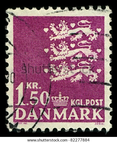 DENMARK-CIRCA 1962:A stamp printed in DENMARK shows image of The national coat of arms of Denmark consists of three crowned blue lions accompanied by nine red hearts,all in a golden shield,circa 1962.