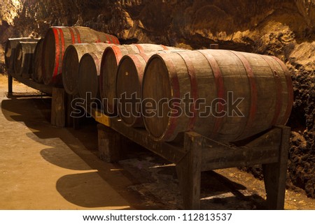 An old wine cellar with oak barrels