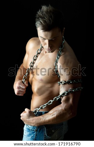 Handsome and muscular young guy with chain
