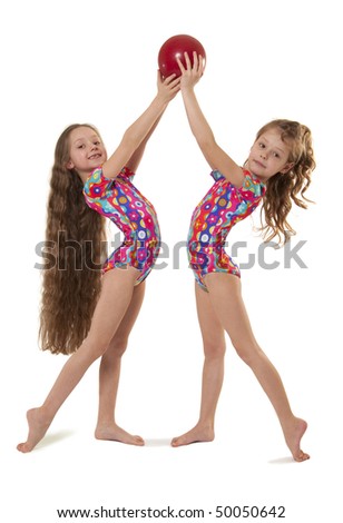 Two little gymnasts with the ball