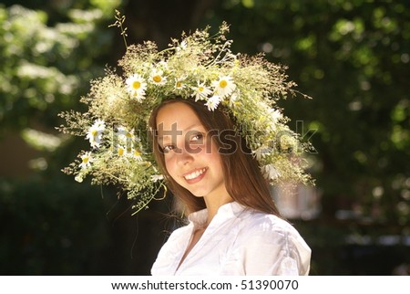 Portrait of a beautiful girl with flower diadem