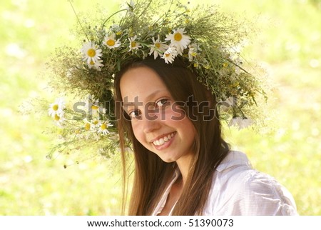 Portrait of a beautiful girl with flower diadem